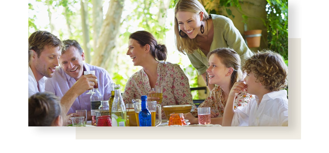 Joyful family enjoying meal in the garden.