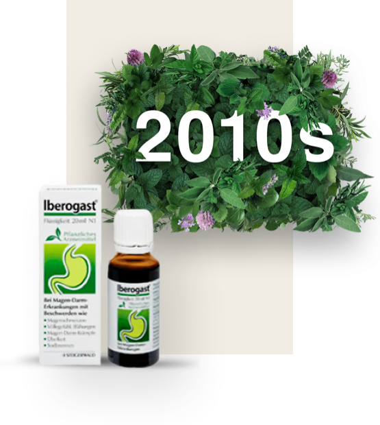 Date 2010s surrounded by leaves, modern white and green bottle of Iberogast with its matching packaging next to it.