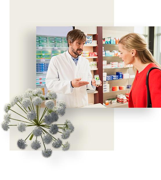 Woman in red sweater buying Iberogast from male salesperson at the pharmacy.