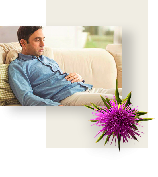 A man in a blue shirt is lying on a couch, suffering from bloating.